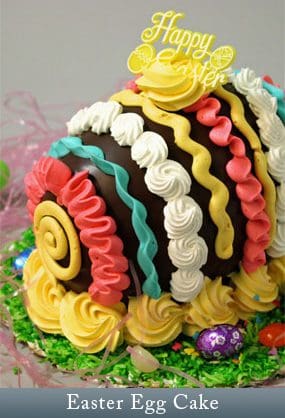 A cake with colorful frosting and chocolate on top.