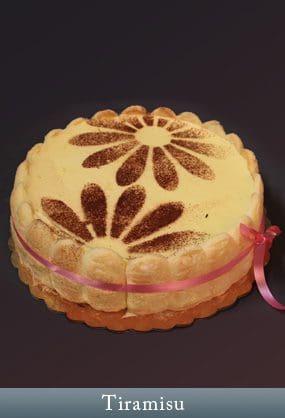 A cake with a flower design on it.