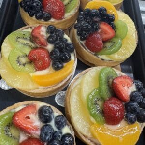Assorted fresh fruit tarts with berries
