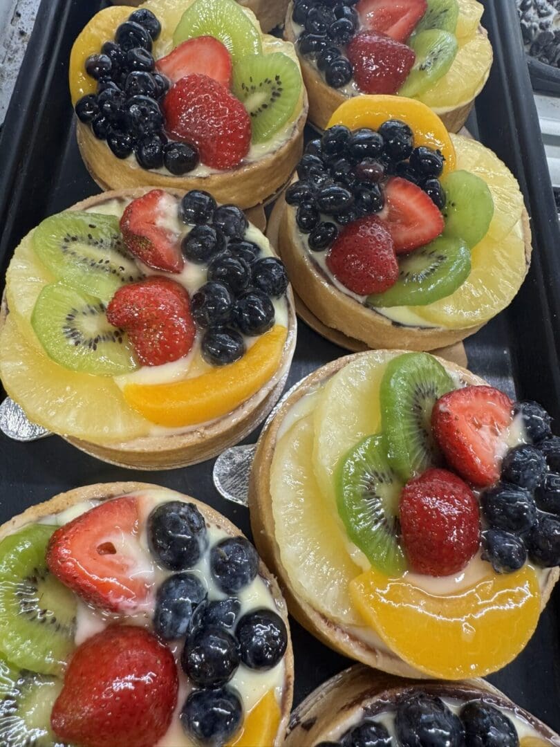Assorted fresh fruit tarts with berries