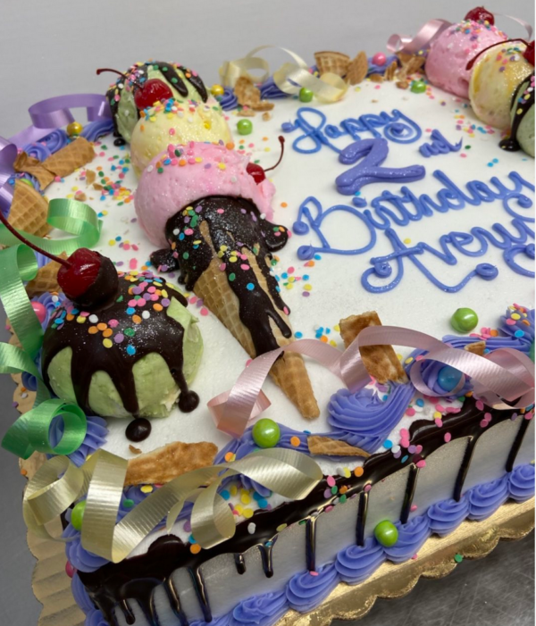 A birthday cake with frosting and decorations on it.