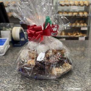 Gift-wrapped cookies with red bow display.